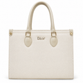 A cream-colored Christian Dior Saffiano leather handbag with gold-tone hardware and a central Dior logo, shown against a plain white background.