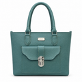 A teal green pebbled leather tote bag with silver-tone hardware, featuring dual top handles, a front flap pocket with a decorative clasp, and a small 'SILKY WEAR' brand plaque on the front.