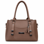 Structured handbag with three zip compartments, top handles and tassel charm